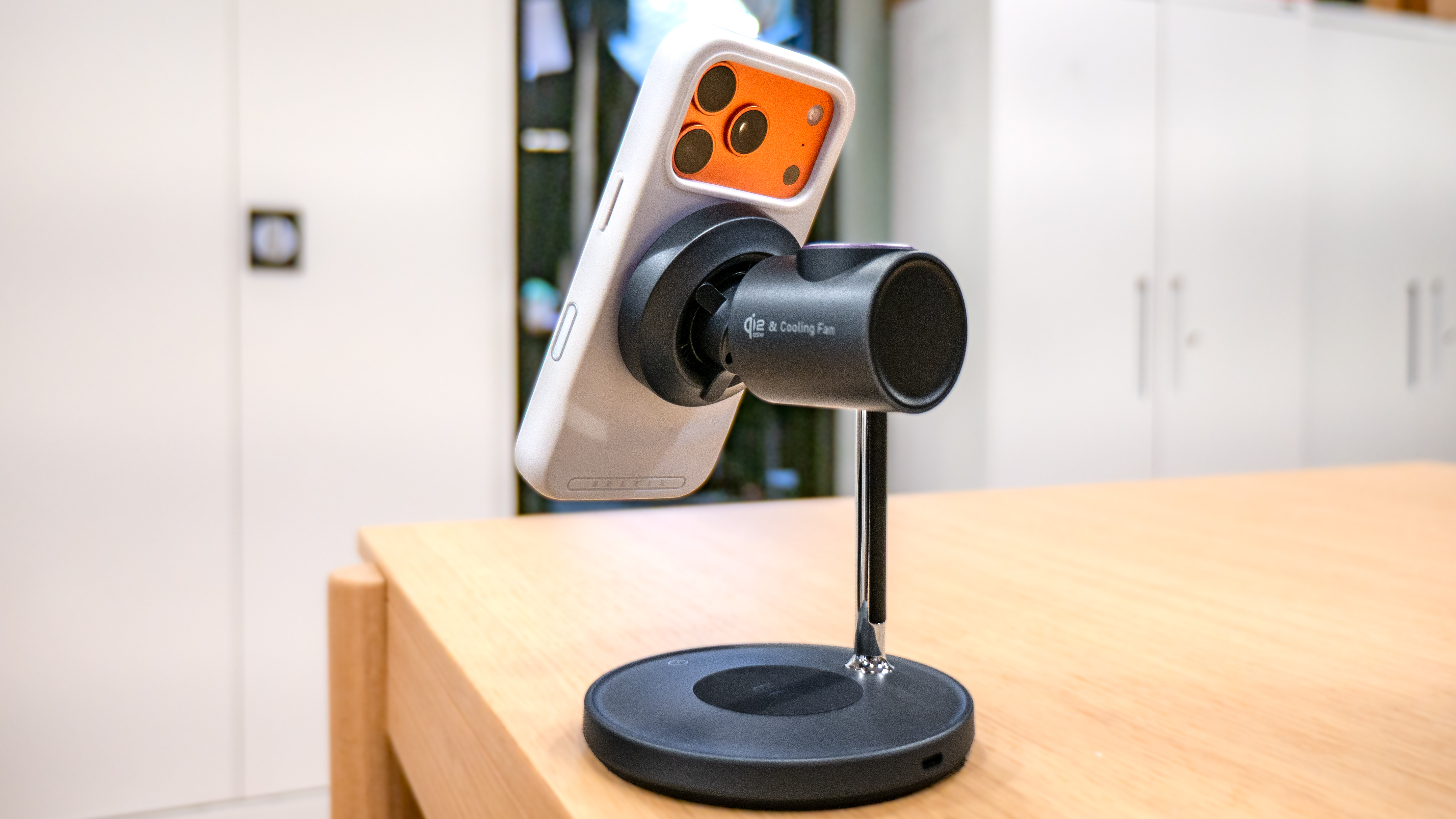 LISEN 3-in-1 Qi2.2 MagSafe Charging Stand with Cooling Fan with iPhone connected to it.