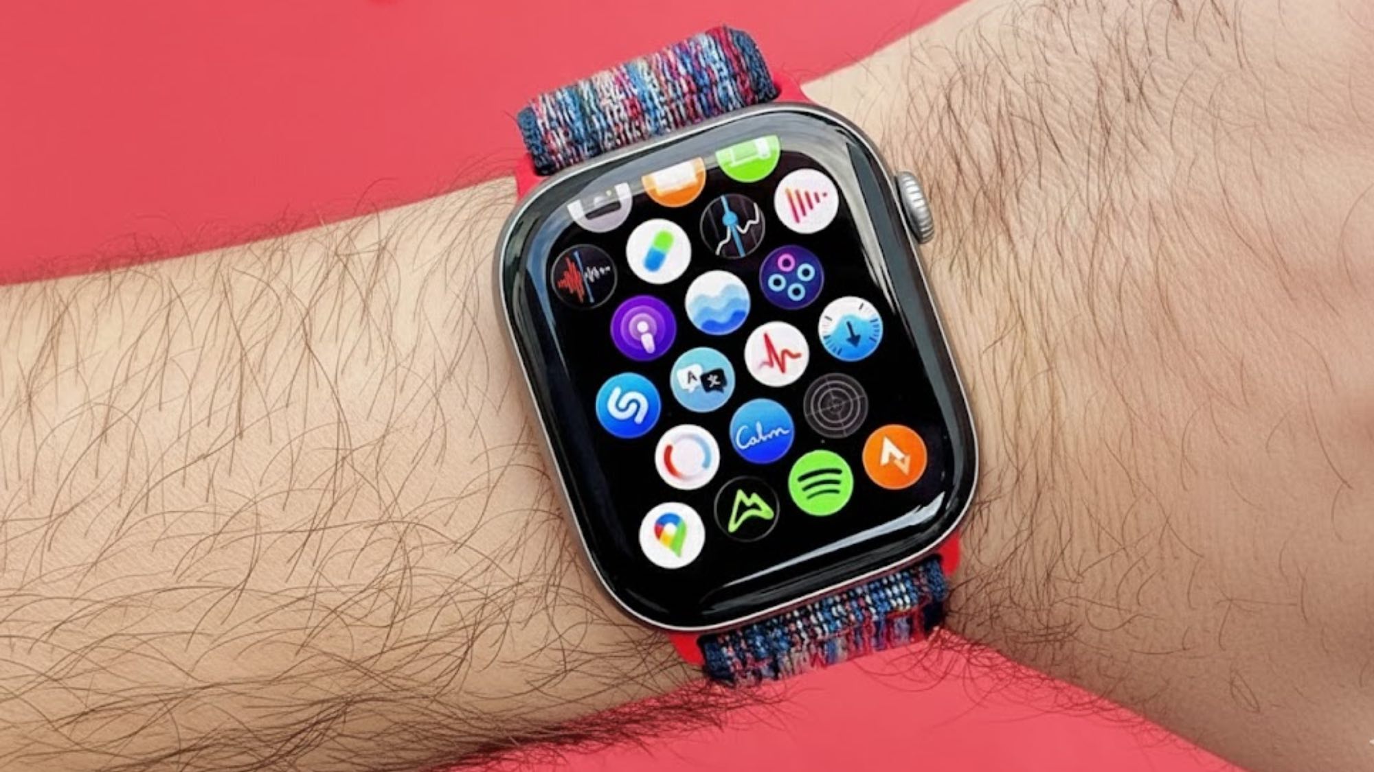 Close the Apple Watch 11 on the user's wrist and the app icon screen is displayed