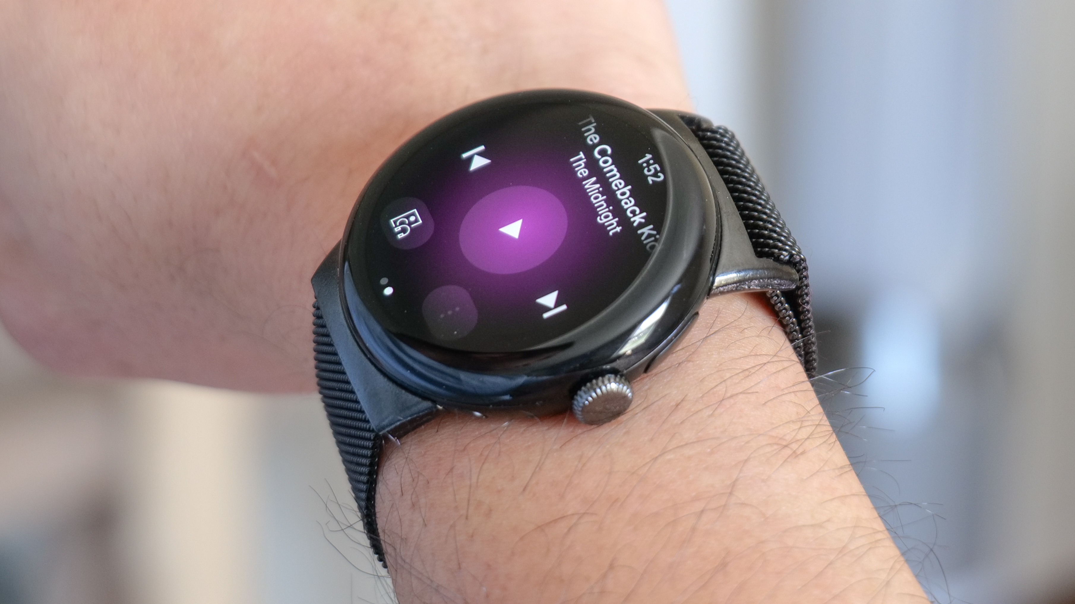 The Pixel Watch displays the YouTube Music app.