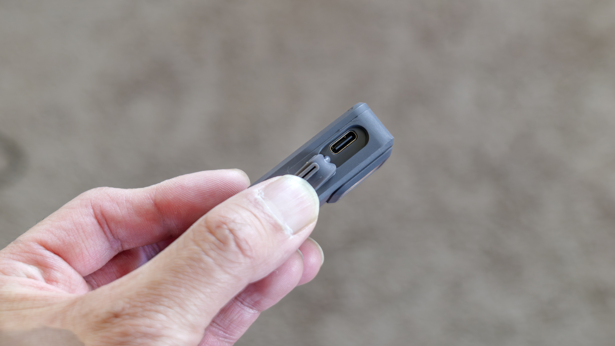 Pebblebee Halo handheld and USB-C port nearby.