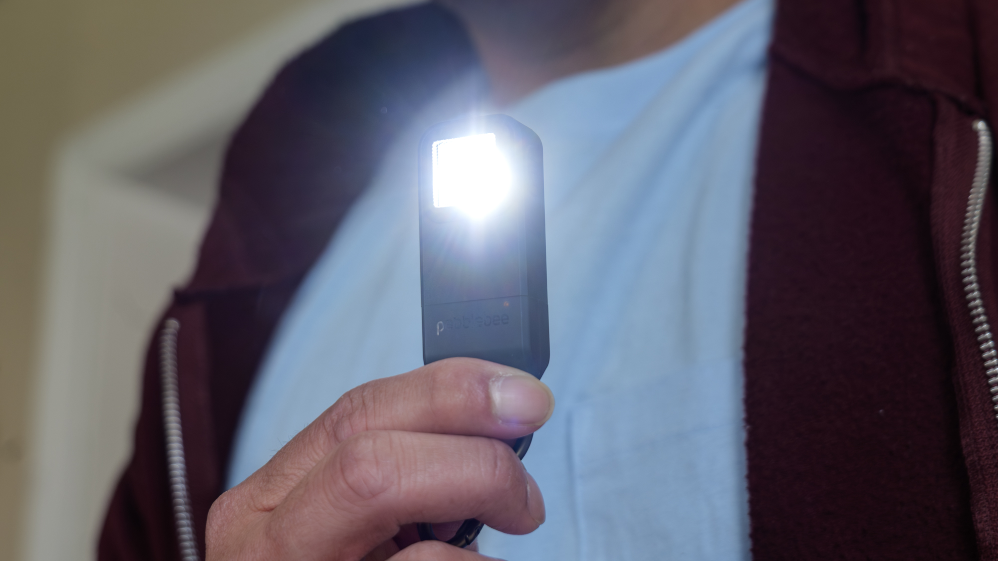 Pebblebee Halo handheld flashlight.